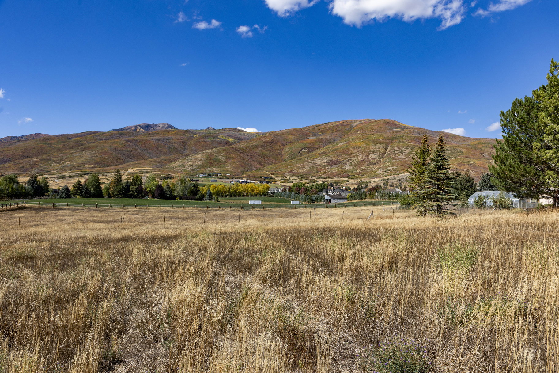 View of mountain backdrop featuring rural landscape