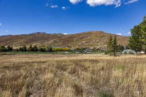 View of mountain backdrop featuring rural landscape