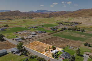 Overview of rural landscape with mountains and large plots for crops