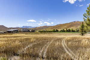 View of mountain backdrop with rural landscape