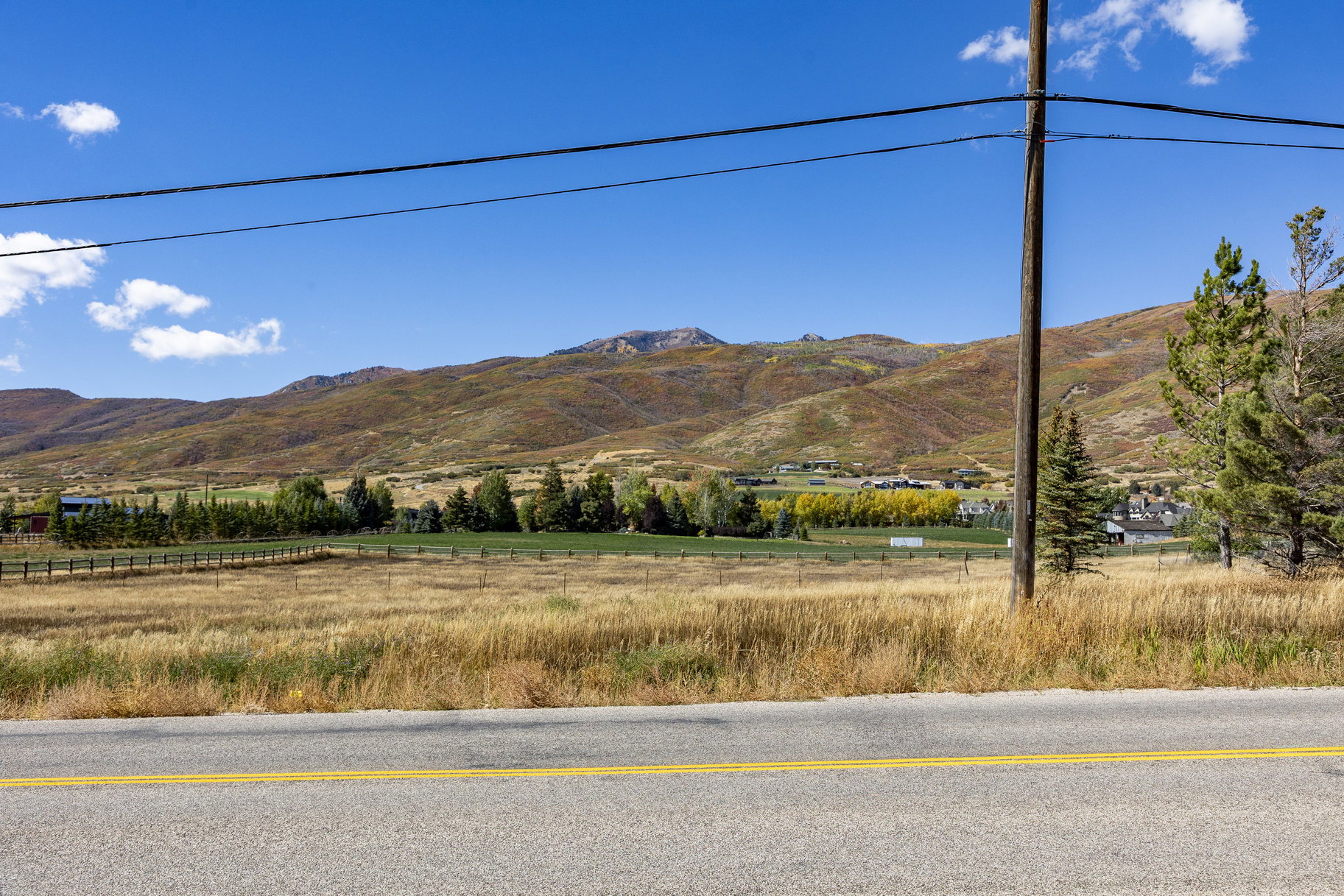 View of mountain background featuring rural landscape