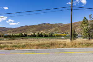 View of mountain background featuring rural landscape