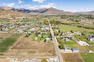 Aerial perspective of suburban area with a mountainous background