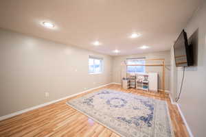 Interior space with light wood finished floors and recessed lighting