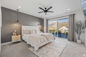 Carpeted bedroom with access to outside, a ceiling fan, and recessed lighting