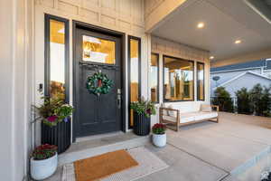 Entrance to property featuring a porch