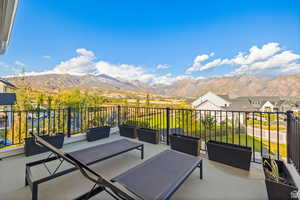 View of patio / terrace featuring an outdoor hangout area and a mountain view