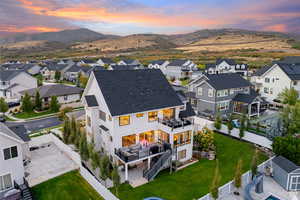 Aerial view at dusk of a residential view and a mountain view