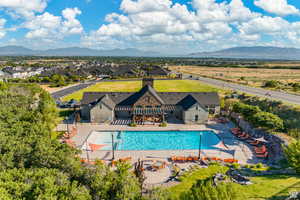 Community pool featuring a patio and a mountain view