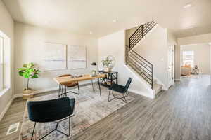 Home office featuring baseboards and light wood-type flooring