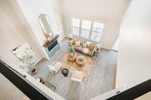 Living area with a high ceiling and baseboards