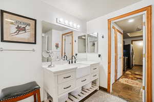 Bathroom featuring vanity and stone finish floors