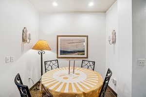 Dining area featuring recessed lighting