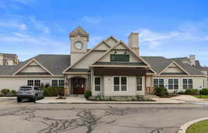 View of front of property with french doors and a chimney