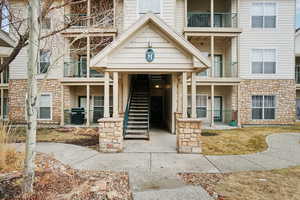 View of apartment building / complex featuring stairway