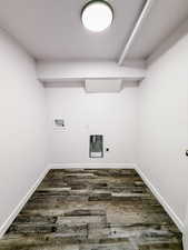 Laundry room with dark wood finished floors, washer hookup, and electric dryer hookup