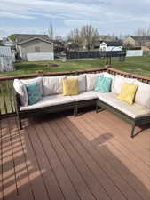Wooden deck with a residential view and an outdoor hangout area