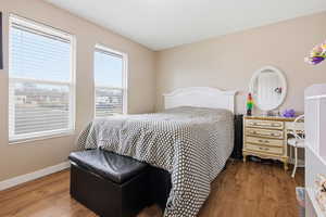 Bedroom with wood finished floors