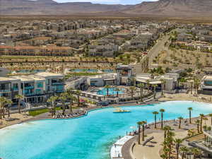 Community pool with a mountain view and a residential view