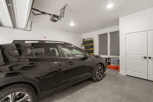 Garage featuring a garage door opener