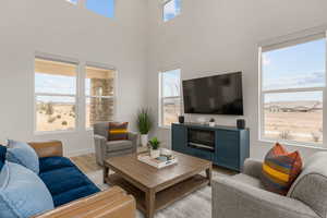 Living room featuring light wood-style flooring and baseboards