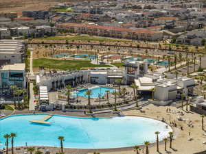 Community pool with a residential view and a patio area