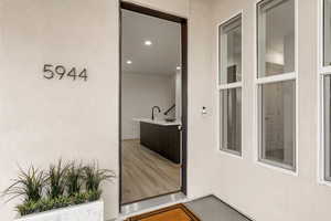 View of exterior entry featuring stucco siding