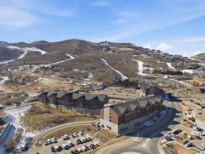 Snowy aerial view featuring a mountain view
