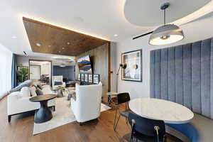 Living area with hardwood / wood-style floors, recessed lighting, and wooden ceiling