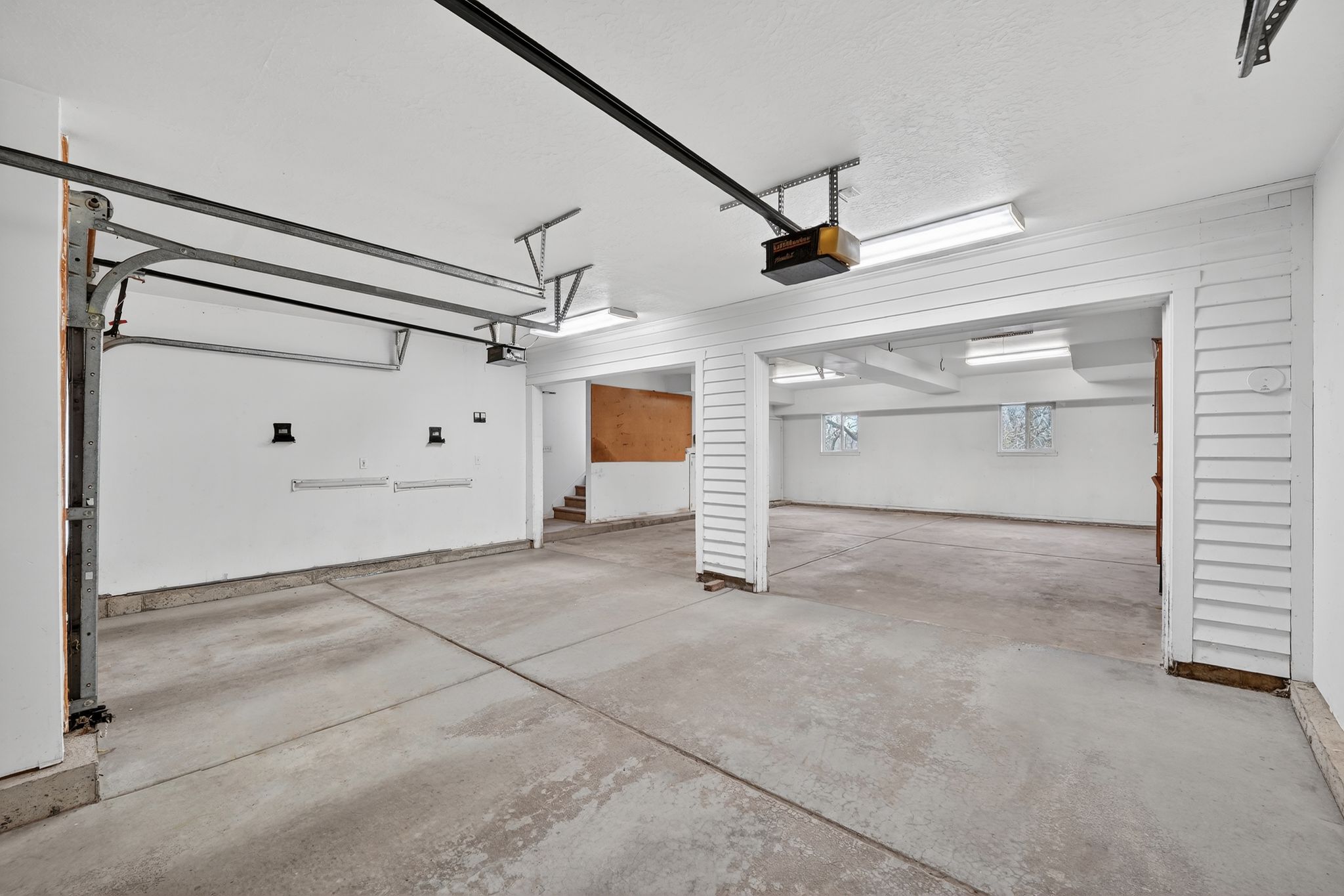 Garage featuring a garage door opener