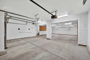 Garage featuring a garage door opener