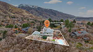 Aerial overview of property's location featuring property parcel outlined and a mountain backdrop