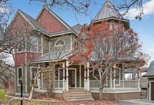 Victorian home featuring a porch