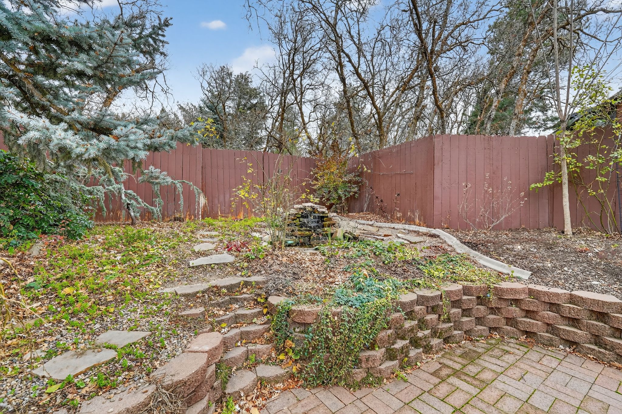 View of fenced backyard