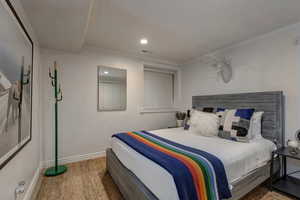 Bedroom with carpet floors, recessed lighting, and ornamental molding