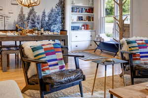 Dining area featuring light wood-style flooring and a chandelier
