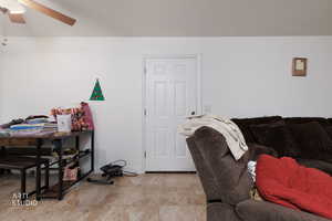 Office area featuring ceiling fan and baseboards