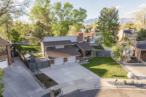 Aerial perspective of suburban area with a mountainous background