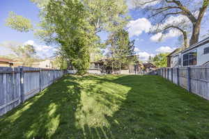 View of fenced backyard