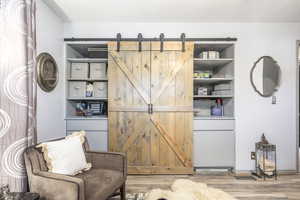 Sitting room featuring a barn door