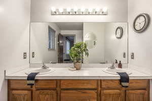 Bathroom featuring double vanity