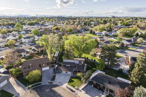 Aerial perspective of suburban area featuring a mountain backdrop