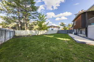 View of fenced backyard