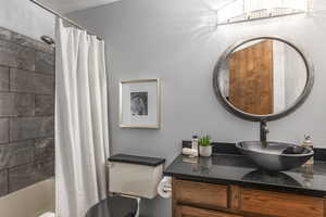 Full bathroom with vanity and shower / bath combo