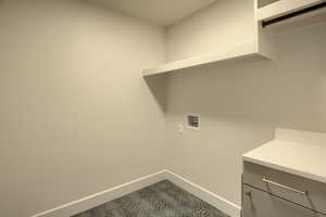 Laundry room with washer hookup and cabinet space