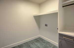 Laundry area featuring washer hookup, cabinet space, and hookup for an electric dryer