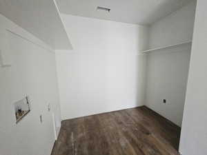 Laundry room with dark wood-style floors and washer hookup