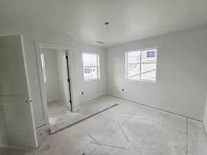 Unfurnished bedroom with baseboards