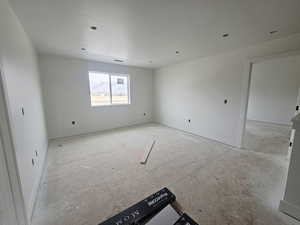 Unfurnished room with baseboards