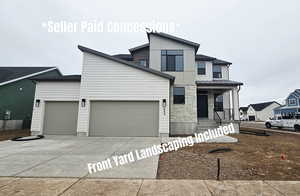 Modern home with covered porch, an attached garage, concrete driveway, and stone siding